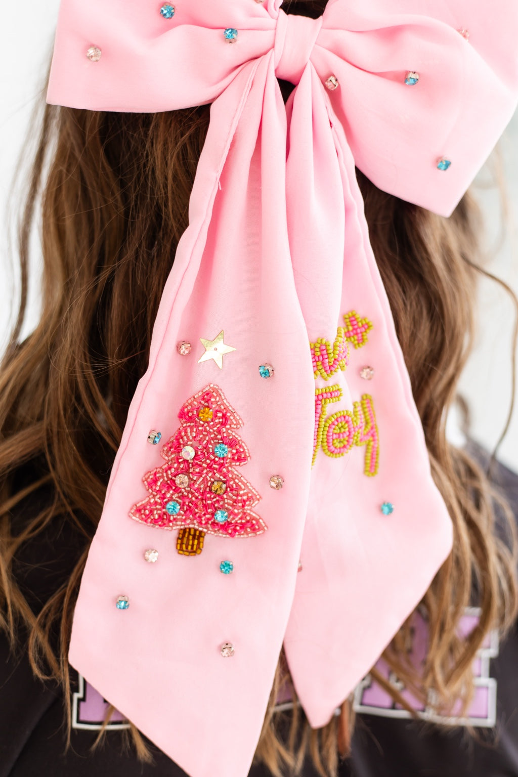 Pink oversized Christmas embellished hair bow with beaded Christmas tree and Joy details