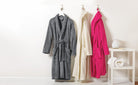 Cozy and soft plush microfleece shawl collar robes in pink, gray, and ivory with belts—perfect for lounging or gifting