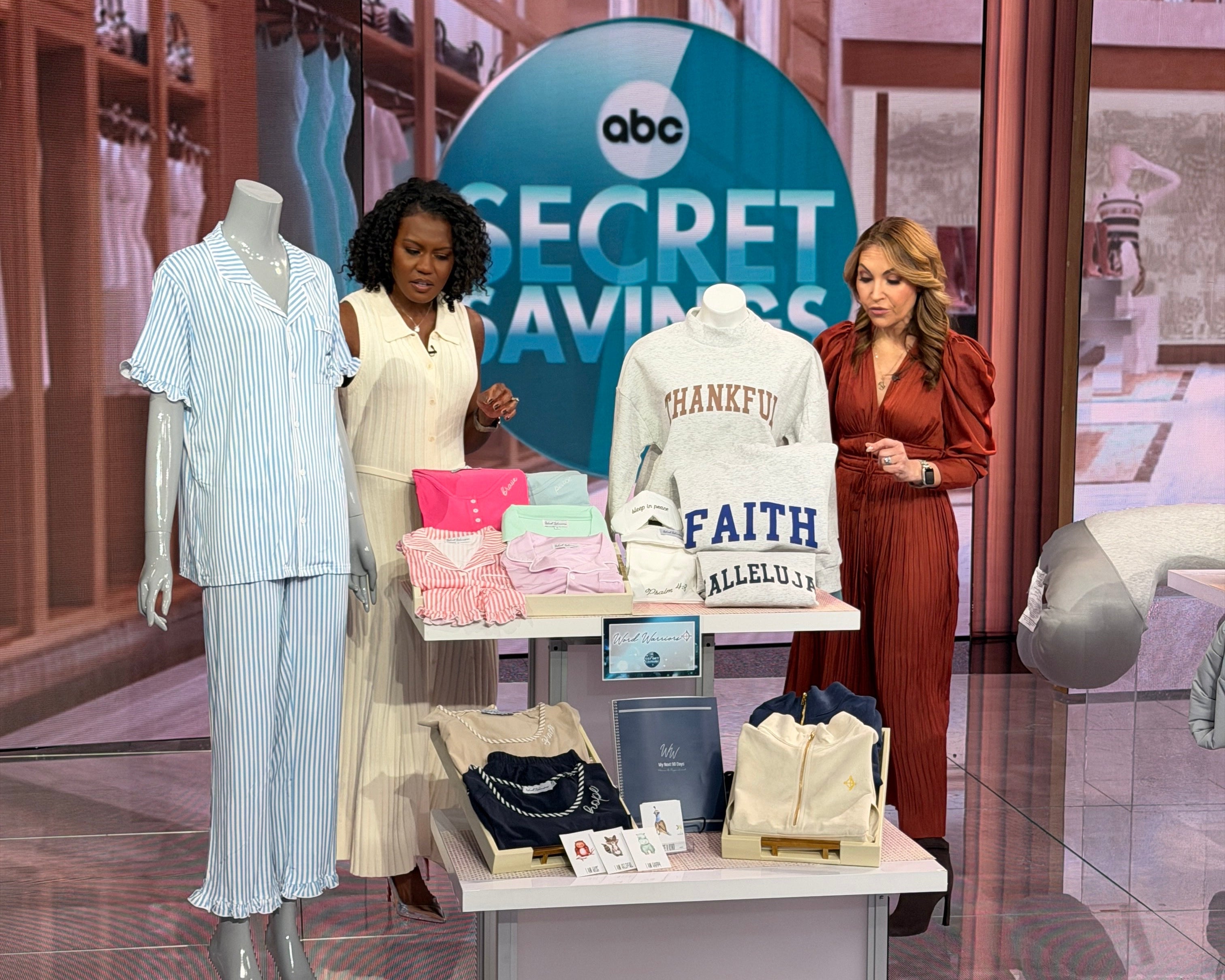 Two women standing in front of a mirror with a 'Secret Fashion' sign and ABC logo.