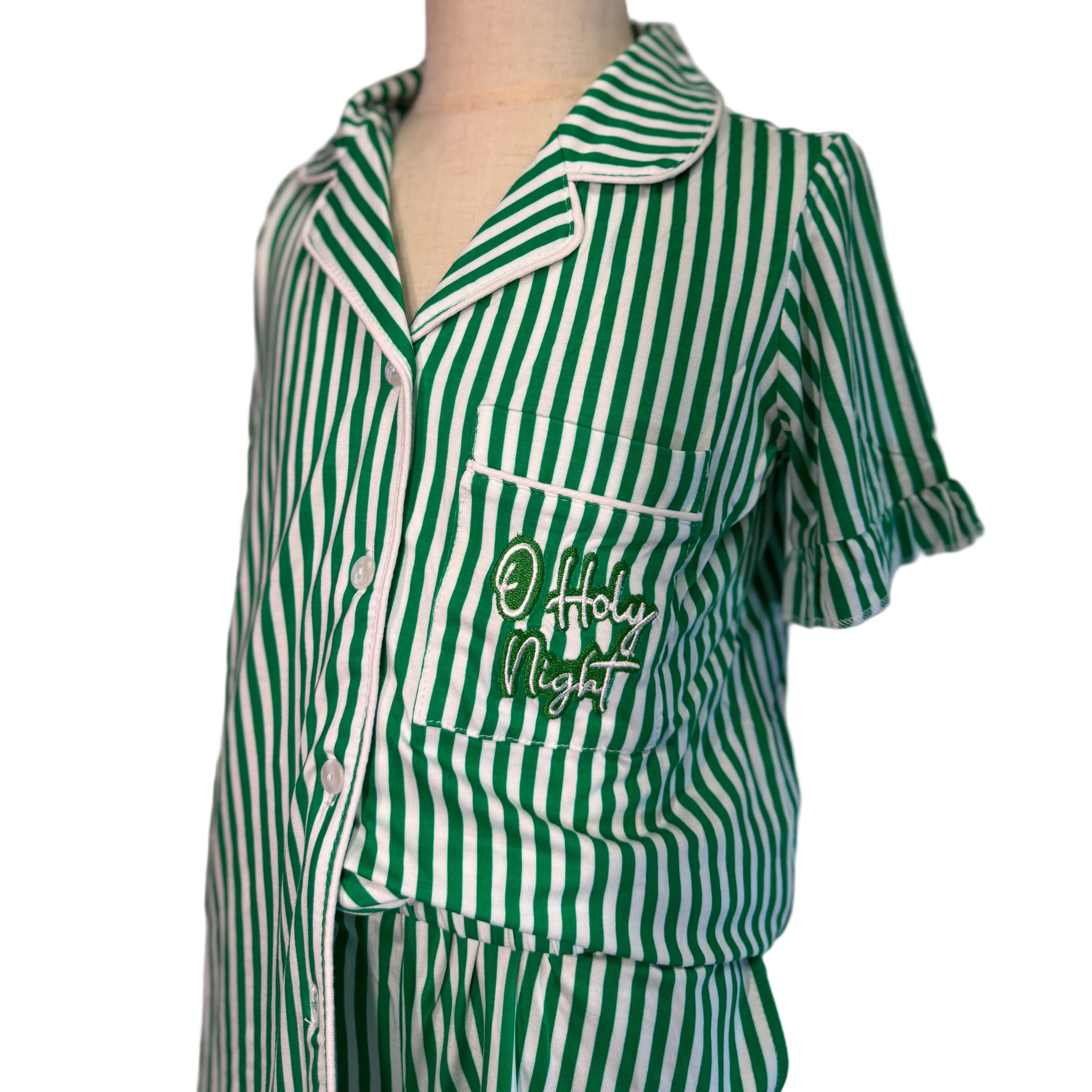 Green and white striped pajama set on a mannequin with 'Good Night' text.