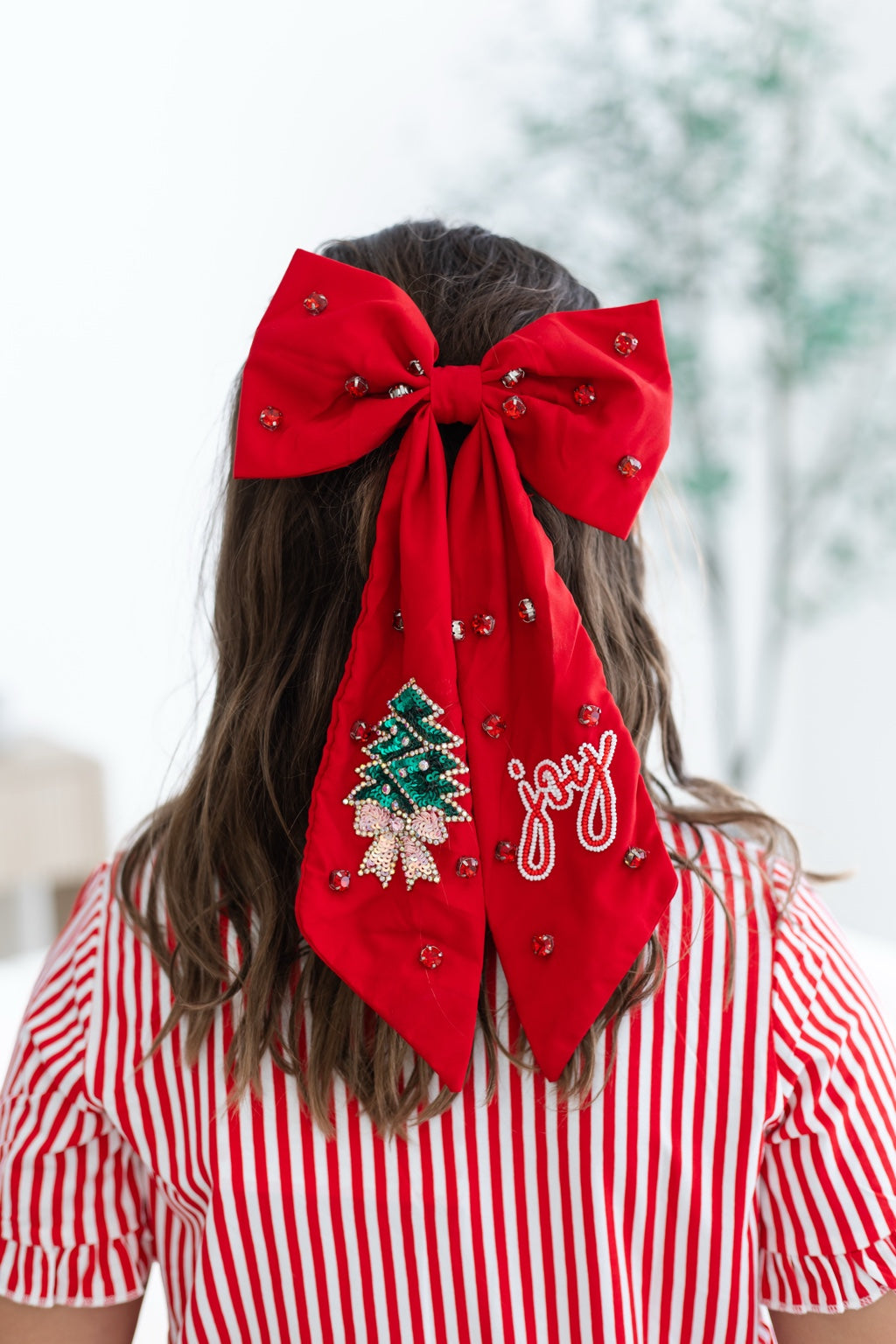 Red oversized Christmas embellished hair bow with jeweled Christmas tree and Joy details