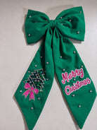 Green oversized Christmas embellished hair bow with jeweled Christmas tree and Merry Christmas details